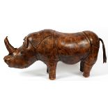 LEATHER OTTOMAN IN THE FORM OF A RHINOCEROS, H 18", L 34"Measures H.18" x 34" x 10".- For High