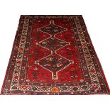 ORIENTAL BALUCHISTAN WOOL RUG, C. 1950-1980, W 5' 3", L 6' 5"Red field with linked diamond shape