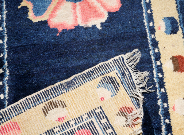 TIBETAN SINO PEKING WOOL RUNNER, H 2' 4", W 6' 4"With a 'ying yang' design in the center of a pink - Image 2 of 2