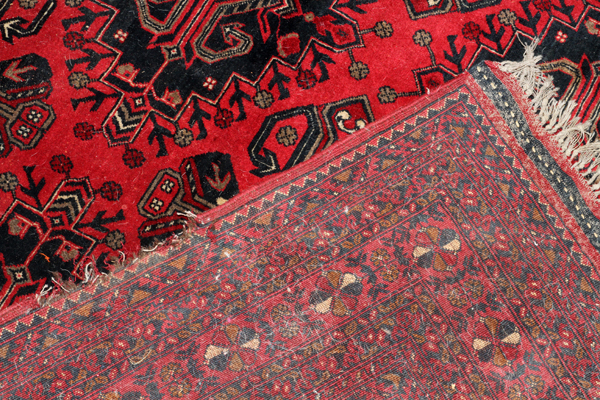 TEKKE BOKHARA WOOL CARPET, W 8' 2", L 11'An all over red ground and design.There is an area of - Image 2 of 2