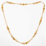 18KT YELLOW GOLD MEHNDI ARABIC NECKLACE, L 32" An 18kt yellow gold filigree link necklace. Weighing