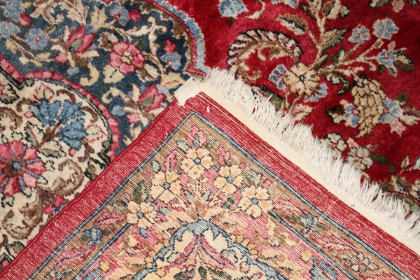 KERMAN PERSIAN WOOL RUG, W 8' 10", L 13' 8"Circa 1920, fine weave, red field.Nice condition.- For - Image 2 of 2