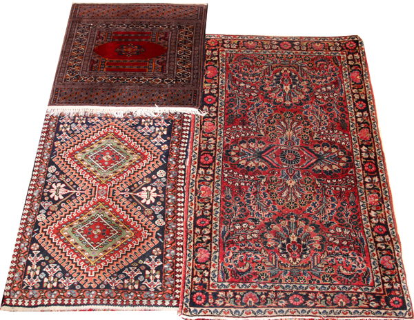 ORIENTAL RUGS, THREEIncluding 1 Bokhara, 26" x 23"; 1 Shiraz, 31" x 24"; and 1 other, 3' 11" x 2'