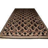 HAND WOVEN WOOL CARPET, 16' 0" X 10' 0"Featuring a black field with overall floral and leaf