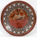 MEXICAN DECORATIVE POTTERY WALL PLAQUE, DIA 22"Hand-decorated with a bird in a sunny landscape.