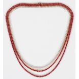 30CT NATURAL RUBY AND 7CT DIAMOND TENNIS NECKLACE, L 16"A three strand necklace with 30ct of natural