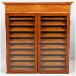 AMERICAN OAK DISPLAY CABINET, C. 1900, H 50", W 46", D 7"Having two glass doors and 10 shelves