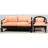 CHINESE TEAKWOOD SOFA AND ARMCHAIRHaving peach cushions and arm rests. Teakwood frames 30''H x 66''W