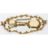 GILT METAL DRESSER SET, FOUR PIECESIncluding a gilt metal and mirrored tray with leaf designs L 24",