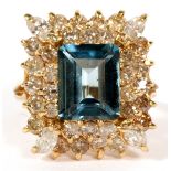 3CT BLUE TOPAZ AND DIAMOND RING, SIZE 6 1/2A 3 ct emerald cut blue topaz surrounded by 34 small