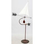 FOLK ART COPPER AND CLOTH SAILBOAT WEATHER VANE, H 68", L 33"Atop the arrow shaped weather vane is a