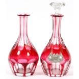 CRANBERRY OVERLAY DECANTERS(2) AND EIGHT SHERRY GLASSESTwo decanters, probably Baccarat and circa