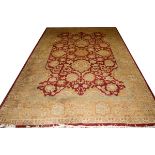 ISPAHAN ORIENTAL WOOL CARPET, W 11' 9", L 17'Having a red ground, and olive floral border; c. 1970'