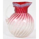 CRANBERRY OPALESCENT SWIRL GLASS PITCHER, C. 1900, H 8"Globular shape with squared and crimped