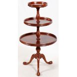 THREE TIERED ROUND MAHOGANY CHIPPENDALE TABLE, H 44", DIA 24"Dish tops. Circa 1970.Good condition