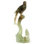 HARDSTONE BIRD CARVING,, H 8"A carved parrot perched above another smaller bird on branches,