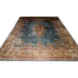 PERSIAN KERMAN WOOL CARPET, C. 1975-1985, W 11' 5", L 14' 6"Central medallion with blue/grey open