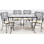 WOODARD CAST IRON PATIO SET, FIVE PIECESIncluding a rectangular glass top table H 29.5, L 48.5", D