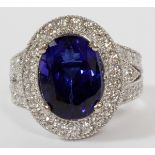 7.8CT TANZANITE AND DIAMOND RING, SIZE 6 3/4, GIAA GIA certified 7.80ct natural oval bluish violet