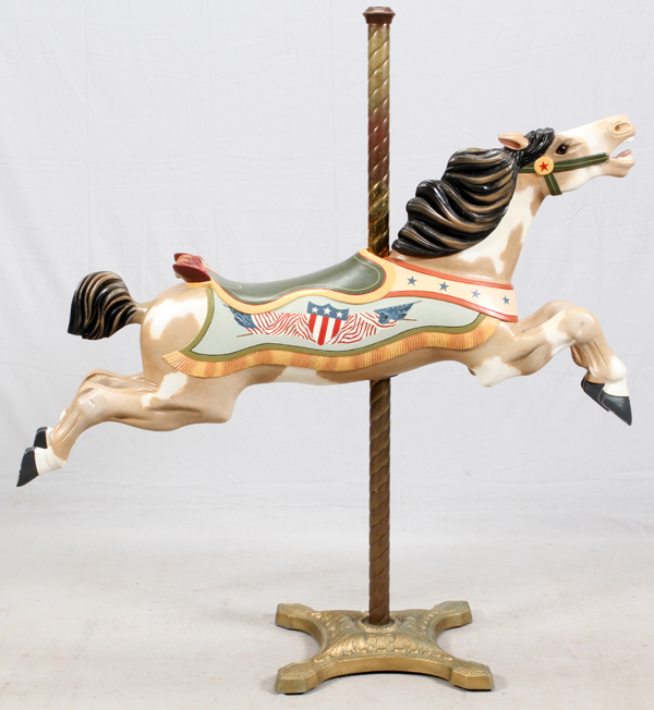 C. W. PARKER WOOD CAROUSEL HORSE, 1920'S, H 24", L 55"A jumping horse with carved leaves at the back