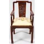 CHINESE HAND CARVED TEAKWOOD ARMCHAIRHeavily carved back panel. H 36" W 20". Circa 1900. Upholstered