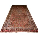 PERSIAN SAROUK DESIGN WOOL HANDMADE CARPET, SEMI-ANTIQUE, H 8' 8", W 17' 4"Having a red ground and