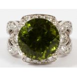 10.15CT NATURAL PERIDOT AND DIAMOND RING, SIZE 7 1/2, GIAA 10.15ct natural round peridot in a 14kt