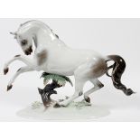 ROSENTHAL PORCELAIN HORSE, H 16", W 21 1/2"The form of a rearing horse; marked at the underside.