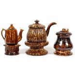 BENNINGTON POTTERY TABLEWARE, H 2 1/2"-6 1/2"Includes 1 teapot and warmer stand, H.2 1/2"- 5",