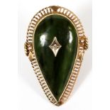IMPERIAL PEAR-SHAPE JADE RING WITH INSET DIAMONDImperial pear shape jade stone with a central single
