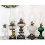 OIL LAMPS, 19TH.C. FIVE PIECES, H 17''-21 1/2''One is green in color, others all clear oil fonts.-