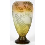 SIGNED GALLE CAMEO GLASS VASE, C.1925, H 9''Tapering form and a footed base, acid-cut leafy branch