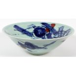 ASIAN POTTERY GLAZED BOWL, H 5", DIA 15"Having a light blue ground with abstract floral designs in