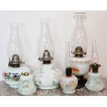 MILK GLASS HAND PAINTED OIL LAMPS, 19TH.C, 6 PIECES, H 10-16''A total of six oil lamps.One is