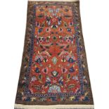 HAMADAN PERSIAN RUG, SEMI ANTIQUE, 5' 7" X 3' 7"An red-orange ground surrounded by a border of