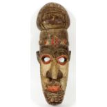 AFRICAN CARVED POLYCHROME WOOD MASK, H 20"An African carved polychrome wood male mask enhanced