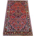 HAMADAN PERSIAN RUG, SEMI ANTIQUE, 5' 1" X 3' 3"A red ground with all over foliate motif and central