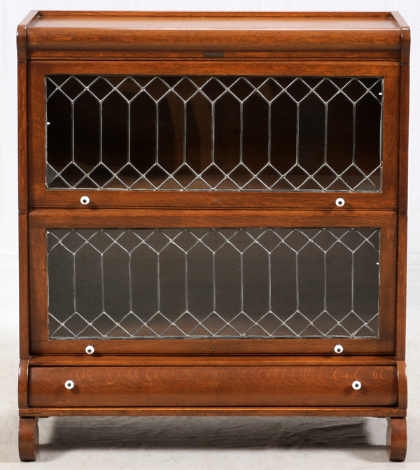 TWO SECTION LEADED GLASS BARRISTER BOOKCASE, H 39", L 33.5", D 13.5"Having leaded glass framed