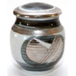 S. STEVENSON, GLAZED POTTERY JAR, H 6", DIA 5 1/4"Decorated with blue-grey and silver tone glazes.In