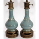 BLUE GLASS LAMPS, PAIR, H 24"Each has light gilt decoration, on an oil lamp style base.Good