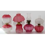 VICTORIAN PINK GLASS OIL LAMPS, 4 PIECES, H 8"-9"Including 3 satin glass, one of which lacks a