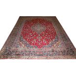 KASHMAR, IRANIAN ORIENTAL CARPET W 9'5" L 12'8"Hand woven, all wool. Burgundy red center field, navy