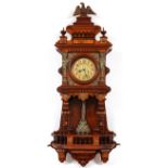 CONTINENTAL OAK WALL CLOCK, H 46", W 21", D 8"Having a carved eagle finial above two spindle finials