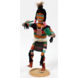 NATIVE AMERICAN CARVED WOOD, KACHINA DOLL, H 14"Depicts a native American dancing holding a melon.