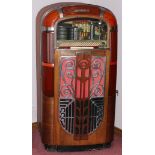 RMC ROCK-OLA JUKEBOX, C.1945, H 58", W 31", D 25"Molded plastic and mahogany case with push