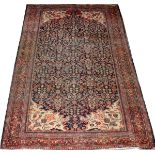 IRANIAN MEGHAN HAND WOVEN WOOL RUG W 4'3'' L 6'3''Having a navy. Ground, three borders, ivory corner