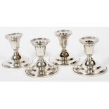 MUECK-CAREY CO. WEIGHTED STERLING CANDLESTICKS, FOUR, H 3 1/2"A set of 4 single light