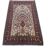 QUM PERSIAN TREE OF LIFE RUG, 5' 2" X 3' 6"Depicting birds, stags, and does with a tree of life at