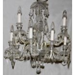 9 LIGHT CRYSTAL CHANDELIER H 34" DIA 28"Nine lights in two tiers. Hand cut crystal prisms.Good