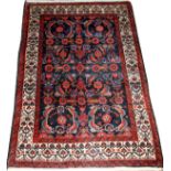 IRANIAN HAMADAN HAND WOVEN WOOL RUG W 3'4'' L 4'9''having a navy ground, three borders including